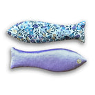 Two fish-shaped sachets, one with floral pattern and one solid purple, on a white background.