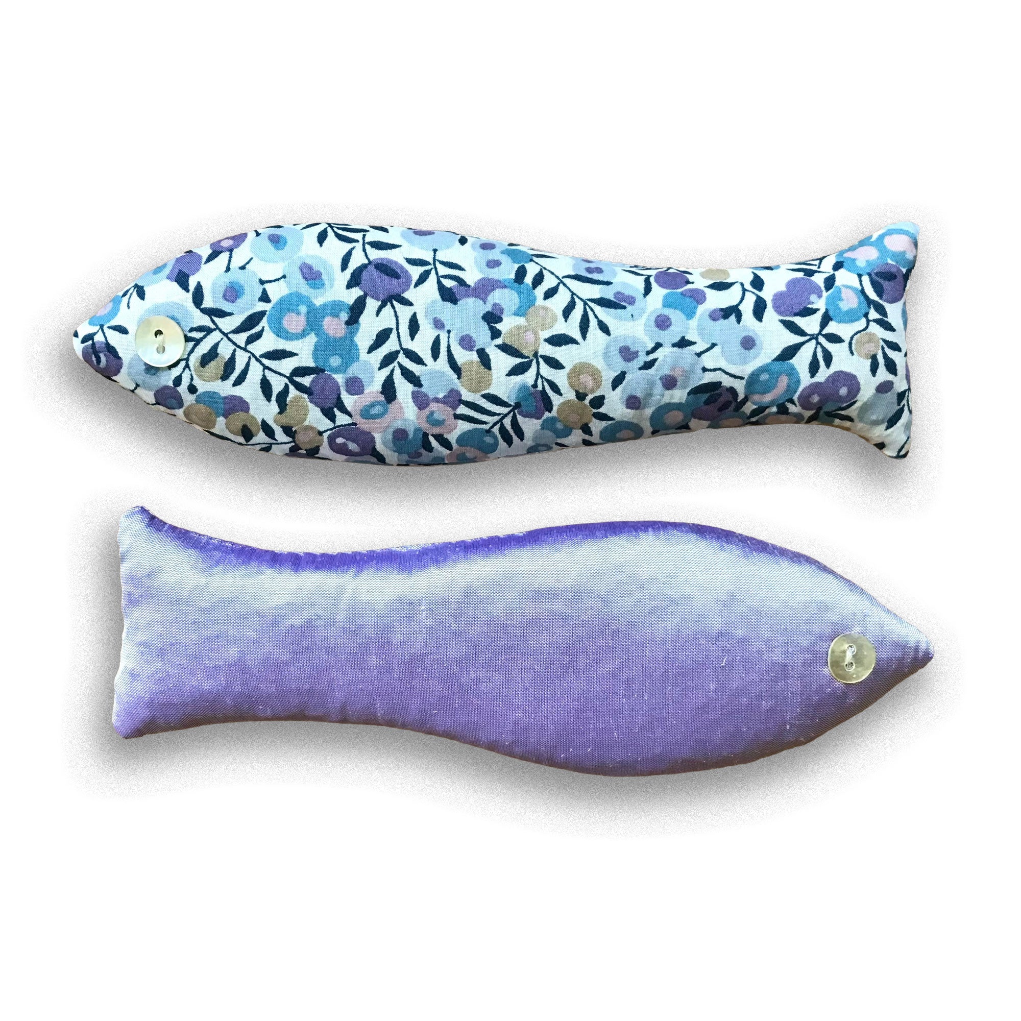 Two fish-shaped sachets, one with floral pattern and one solid purple, on a white background.