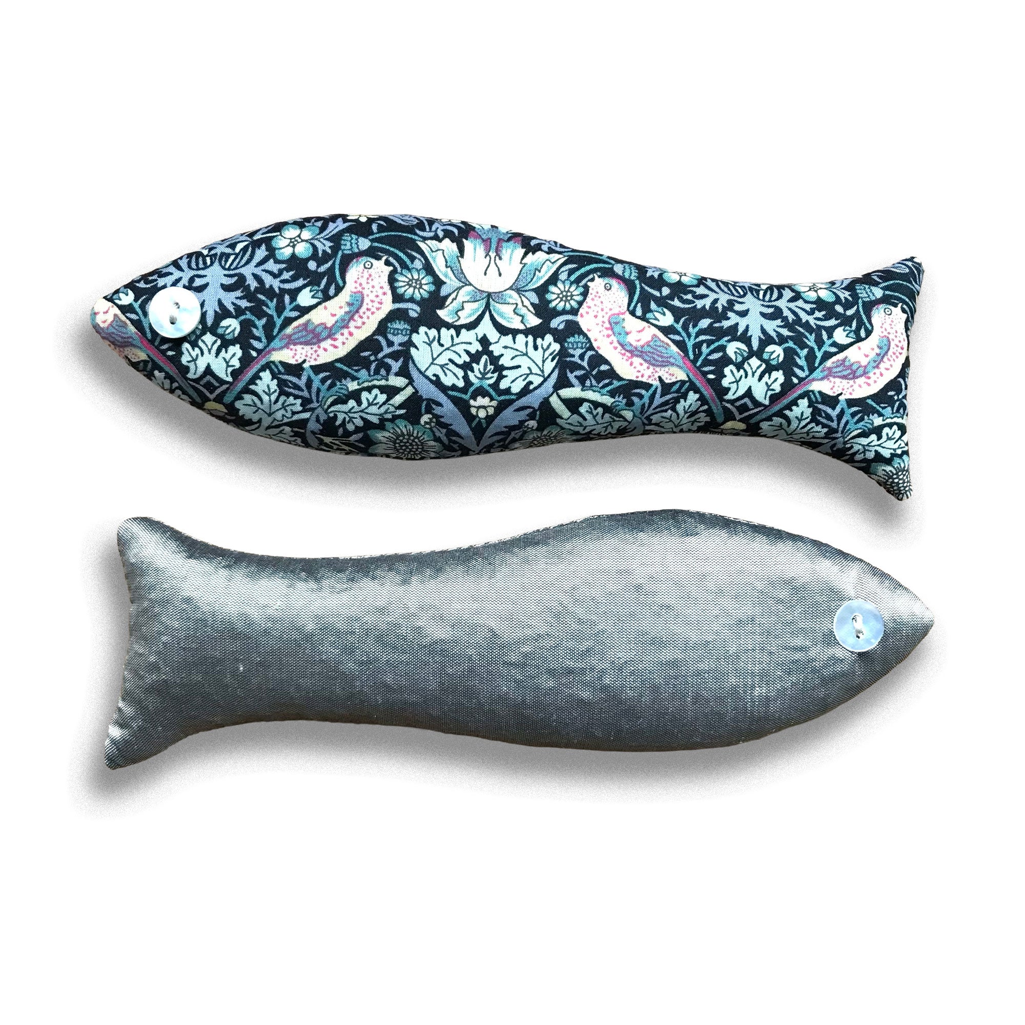 Two fish-shaped cotton lavender bags, one with a floral pattern and the other plain gray, on a white background.