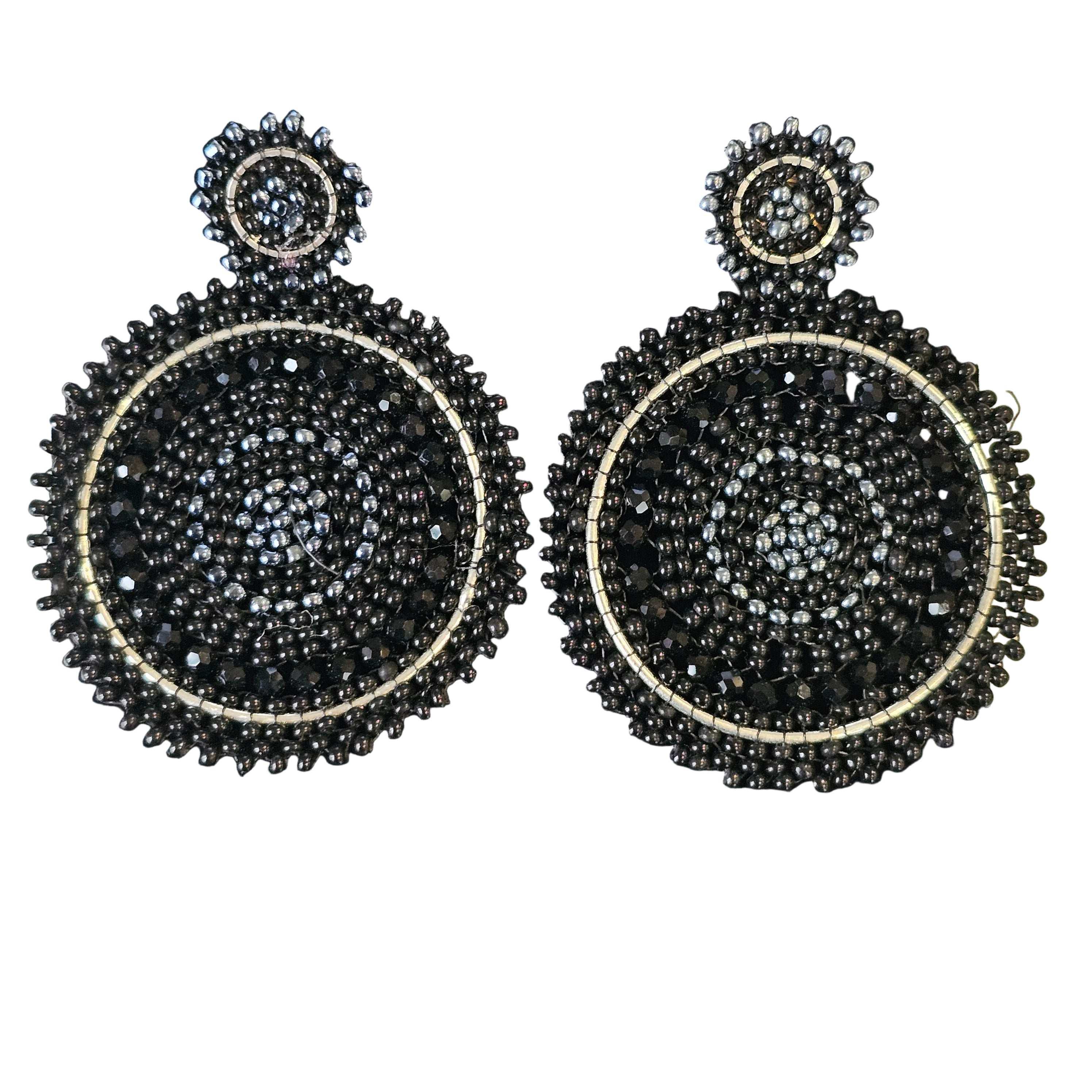 Pair of black and gold beaded earrings on a black background