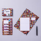 Letter set with bookshelf design on cover and spine, pen on grey background