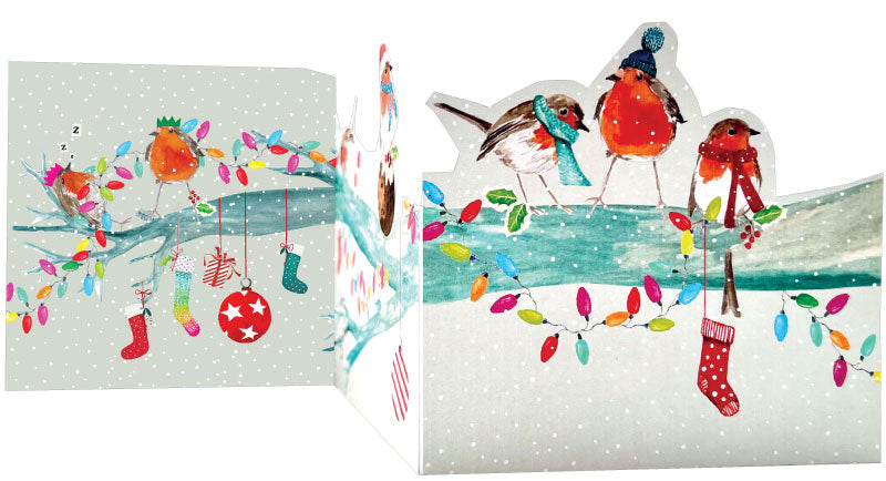Christmas card with birds, lights, and stockings on a snowy background