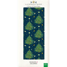 A pack of tissue paper wrap featuring a design with dark blue background, decorated with stars and moons, surrounding classic Christmas trees.
