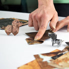 An image of paper pups being folded.