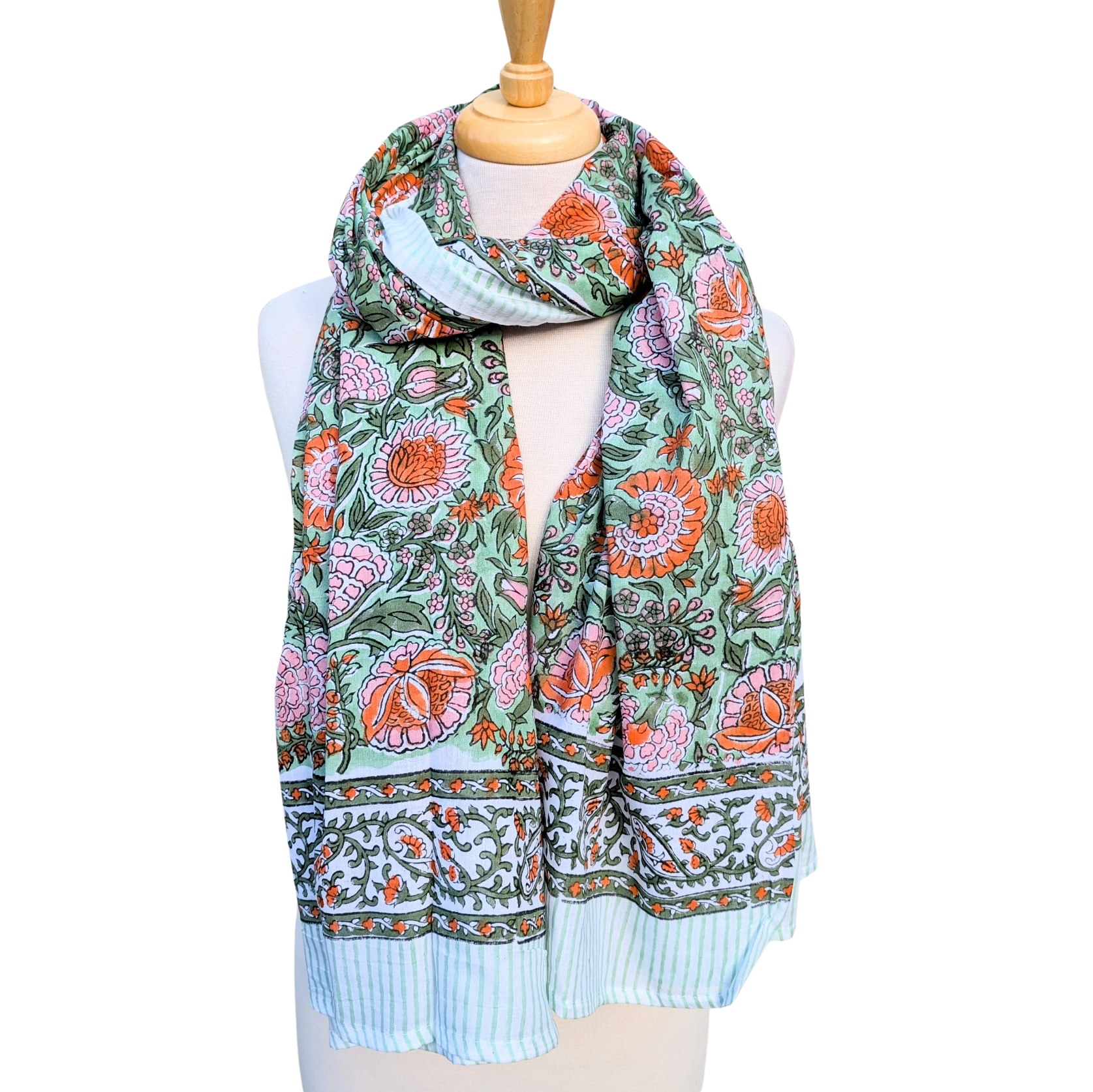 Floral patterned scarf on a mannequin with a white background