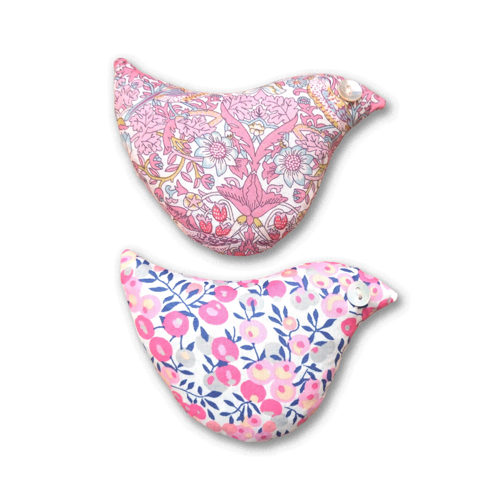 Two pink floral-patterned bird-shaped sachets on a white background
