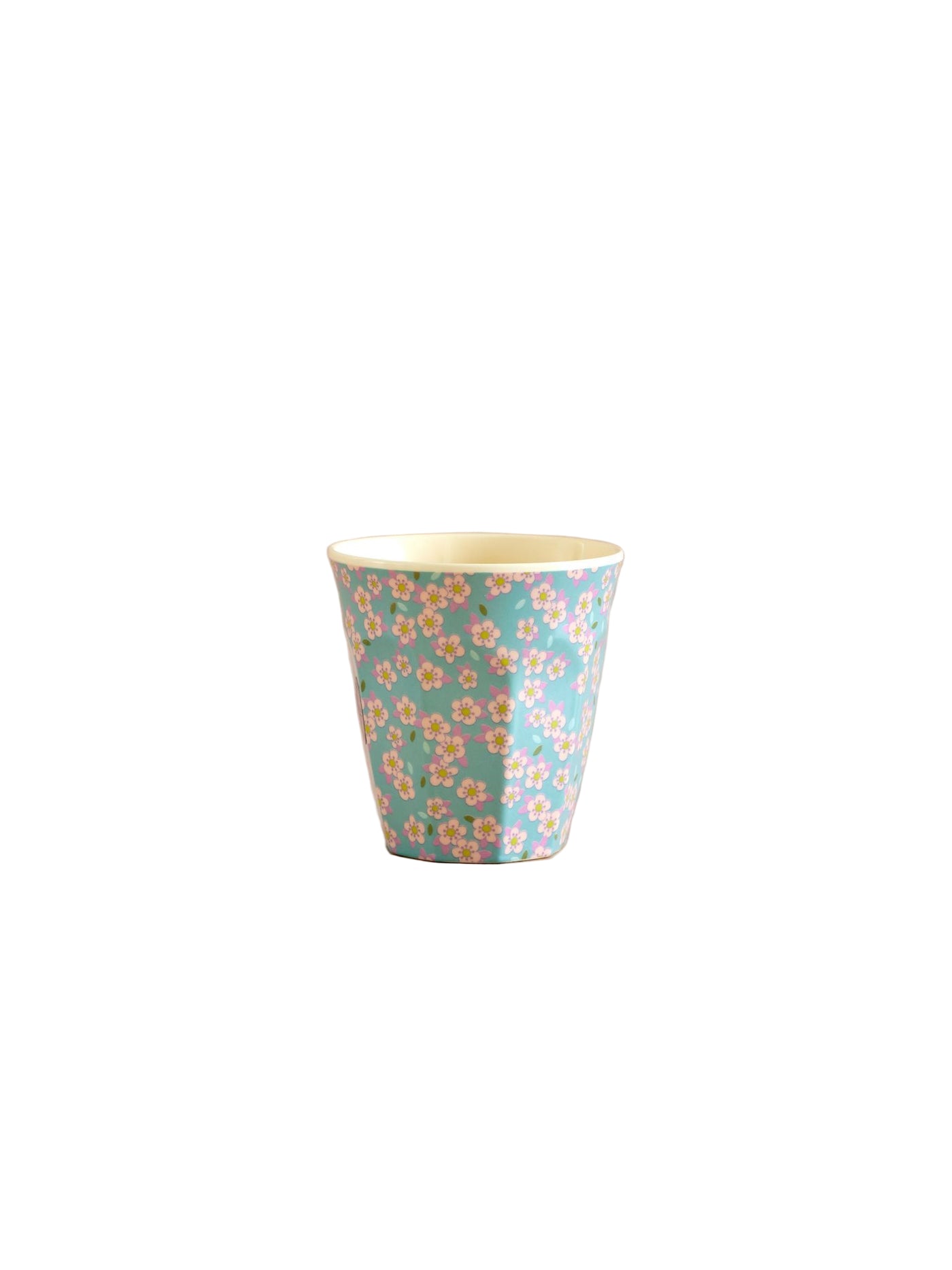 Floral-patterned cup on a beige background