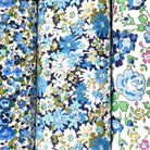Three floral cotton hankies with blue, green and white patterns.