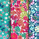 Three colourful floral fabric hankies arranged side by side.
