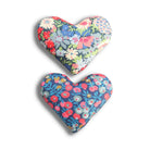 Two blue and red floral lavender sachets on a white background. 