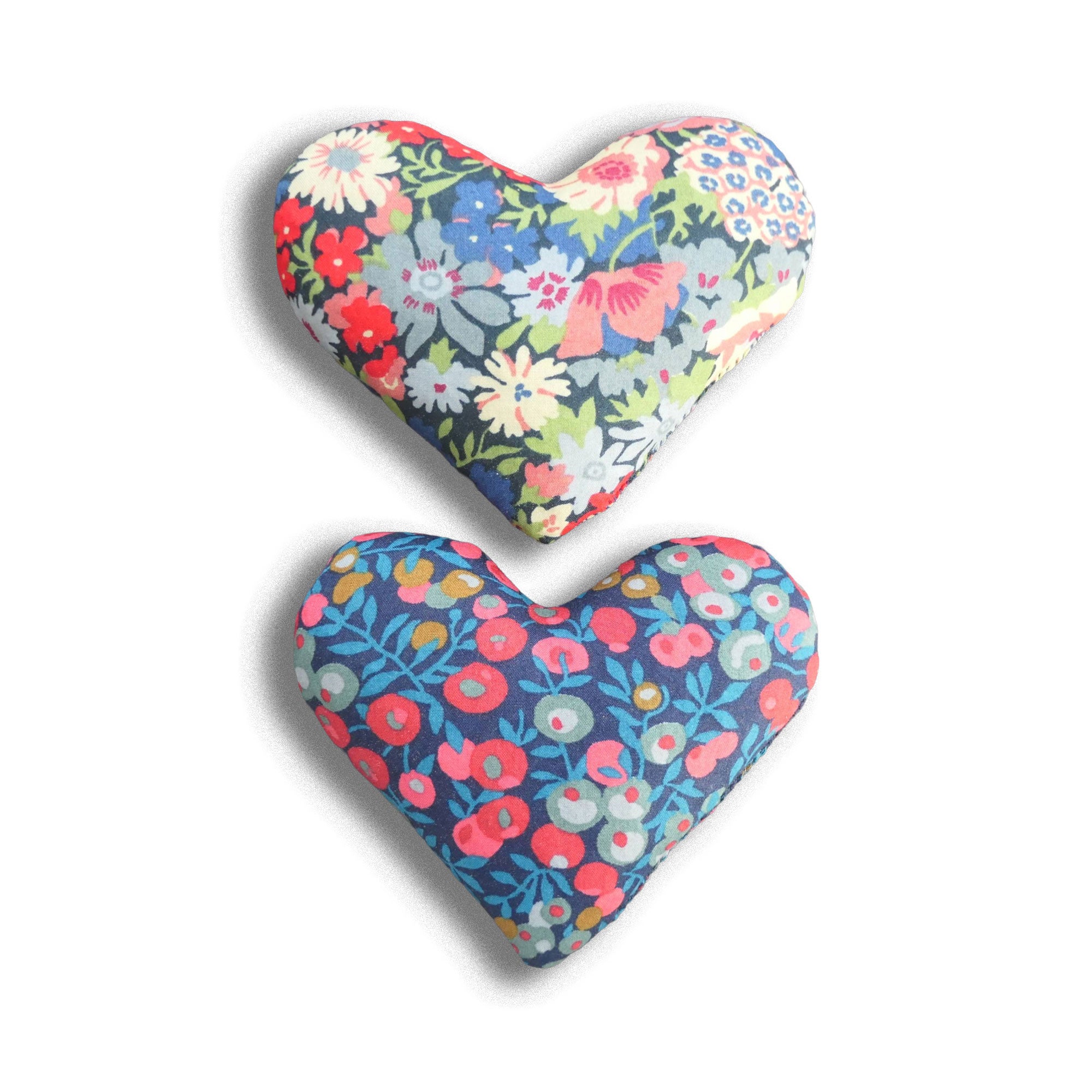 Two blue and red floral lavender sachets on a white background. 