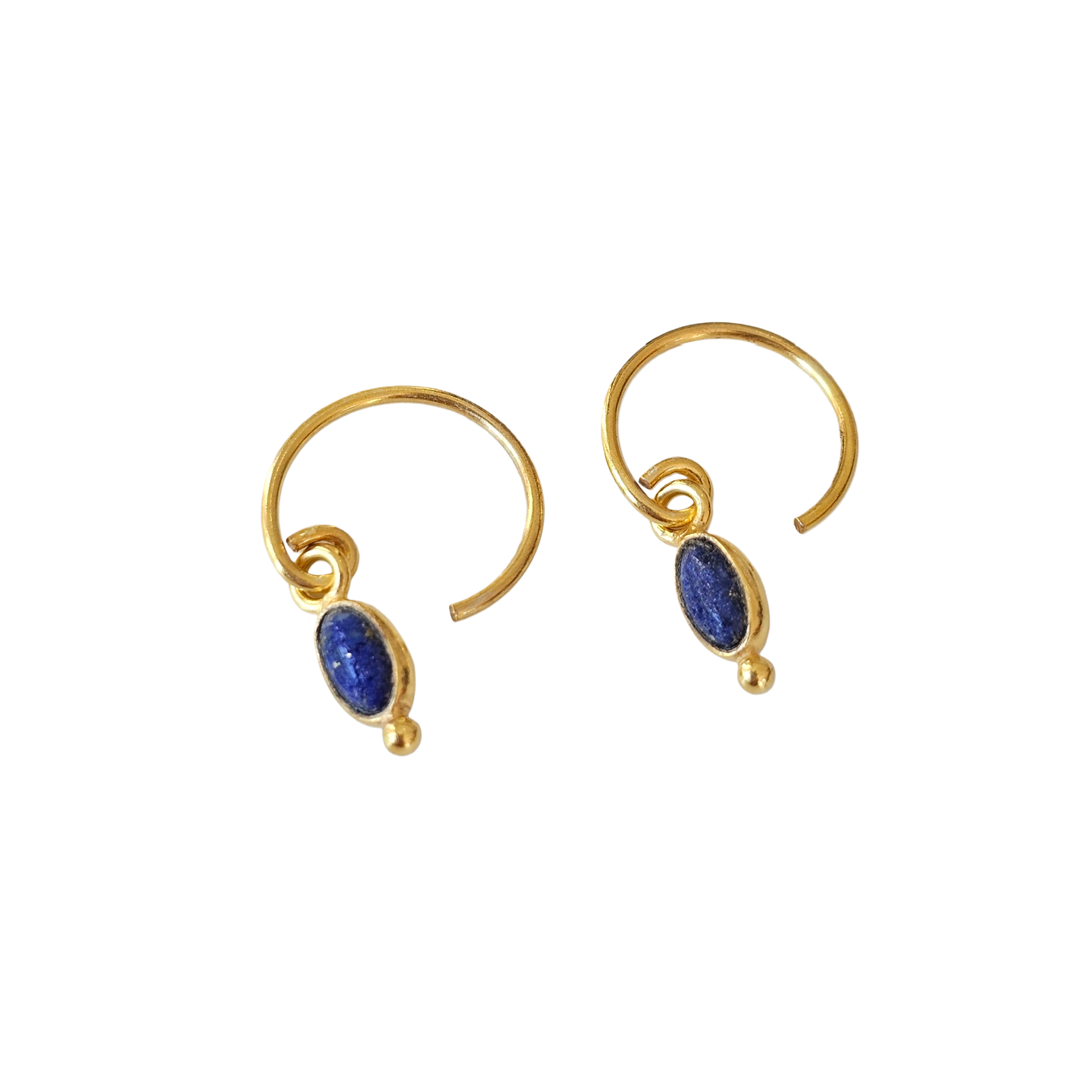 Gold hoop earrings with blue stones on a white background