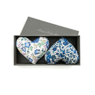 Two floral heart-shaped lavender-filled cushions in a box with 'lime tree design' branding.