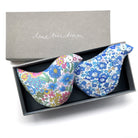Two floral-patterned bird-shaped lavender pillows in a box with 'lime tree design' branding.