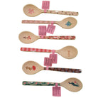 Set of decorative spoons with floral and patterned handles on a white background
