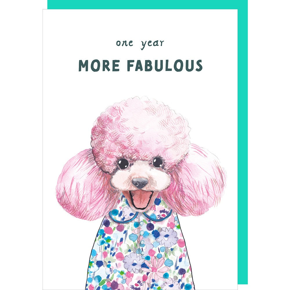 Card with a illustration of a pink poodle and text 'one year more fabulous' on a white background.