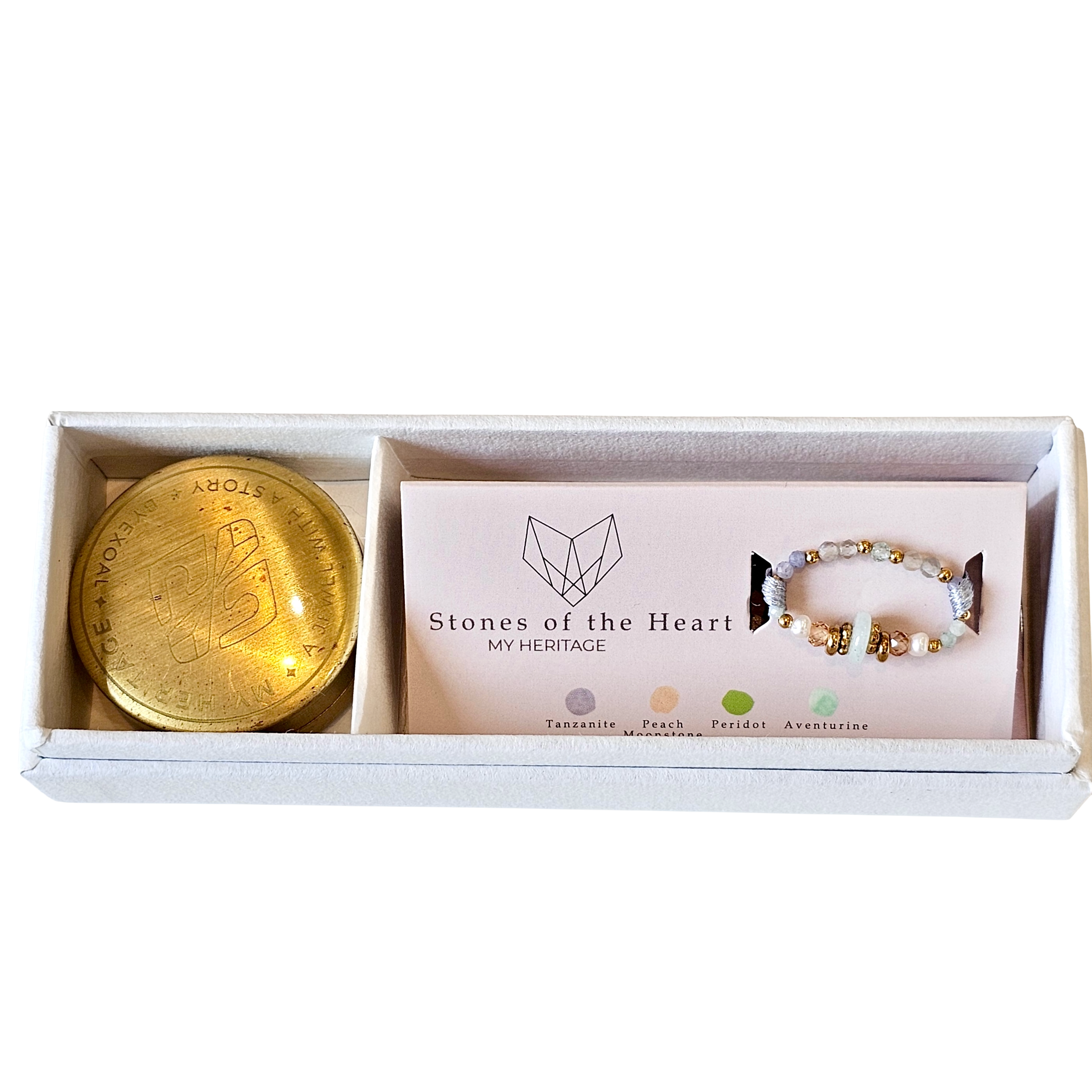 Beaded ring and gold trinket box in a 'Stones of the Heart' box on a white background