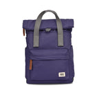 Purple backpack with grey straps on a white background
