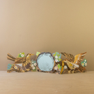 Decorative concertina card with birds and flowers against a beige background