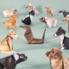 Paper pups origami dogs on light green background