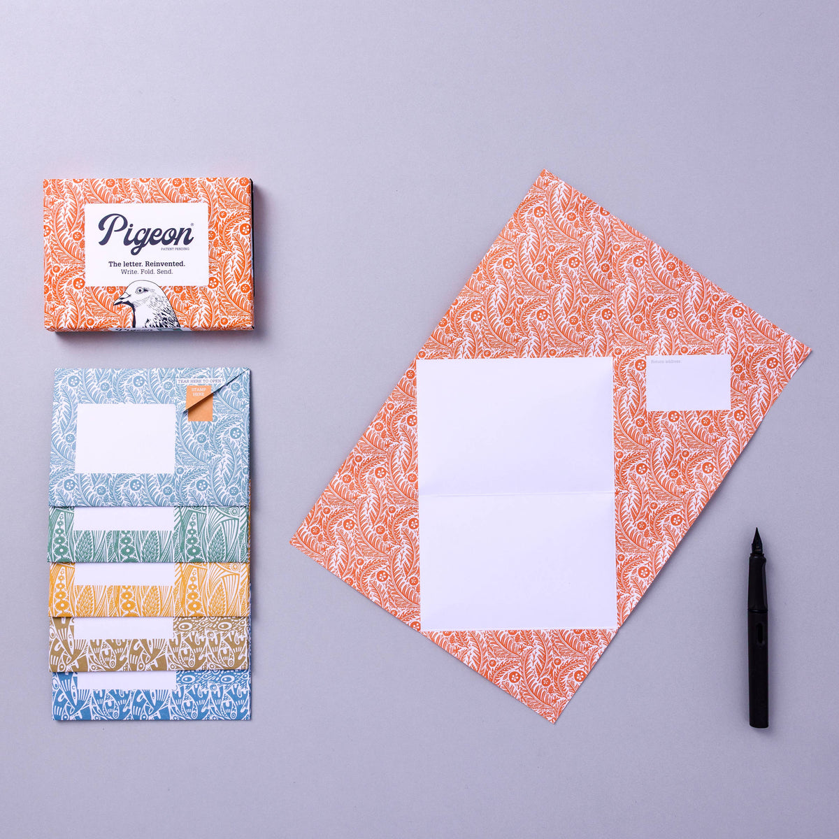 Pigeon stationery set with patterned envelopes and boxes on a grey background