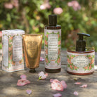 Set of rose  skincare products on a wooden surface with floral background