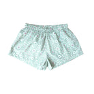 Floral patterned shorts on a white background