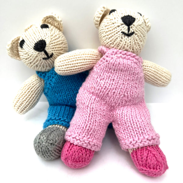 knitted soft toy polar bear in Pink dungarees