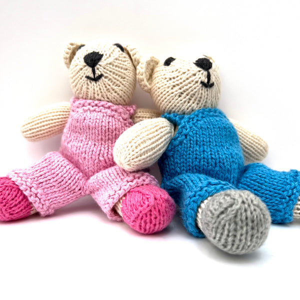 knitted soft toy polar bear in Pink dungarees
