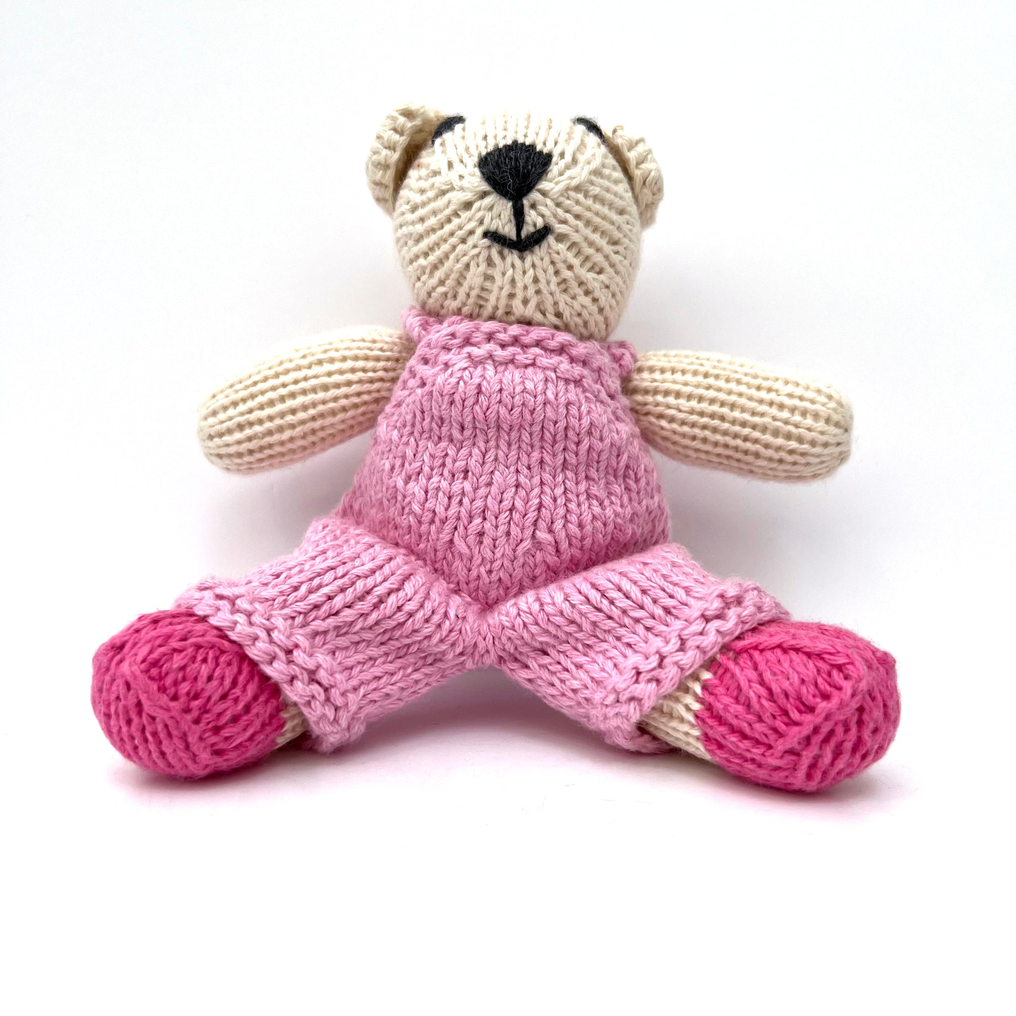 knitted soft toy polar bear in Pink dungarees
