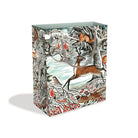 Image of a gift bag with a grey cord handle and round tag. Design is winter in nature themed featuring deer, squirrels, robins, pheasants in a snowy field surrounded by trees. 