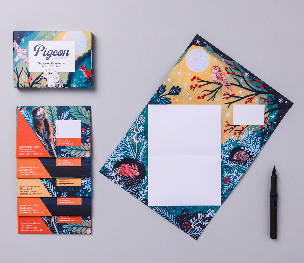Colourful letter set with envelopes and cards on a grey background