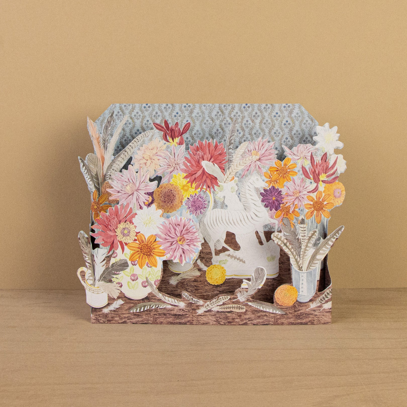3D floral card with zebra design on a wooden surface and beige background