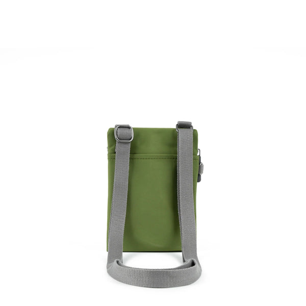 A photo of the back of a small rectangular avocado green pocket bag. It has a pocket and grey straps.