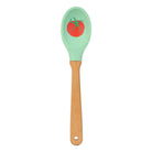 Spatula with green head and wooden handle on a white background