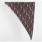 A triangular scarf with a dense floral and berry pattern in pink, red, green, and blue, featuring fringed edges, displayed against a plain white background.