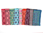 Set of colorful patterned scarves arranged in a row on a white background