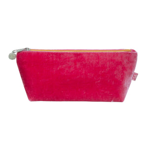 photo of a dusty dark pink pouch with pale orange zip and beaded zip pull, against a white background