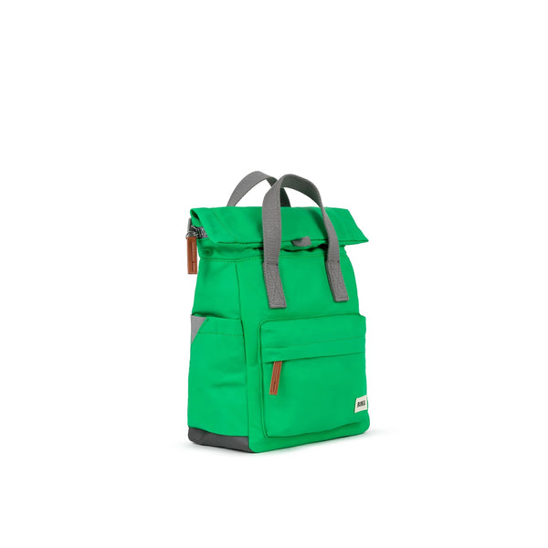 Photo showing the front and side of a small bright green backpack. There is a large pocket on the front with a brown zip pull, and the handles are grey.