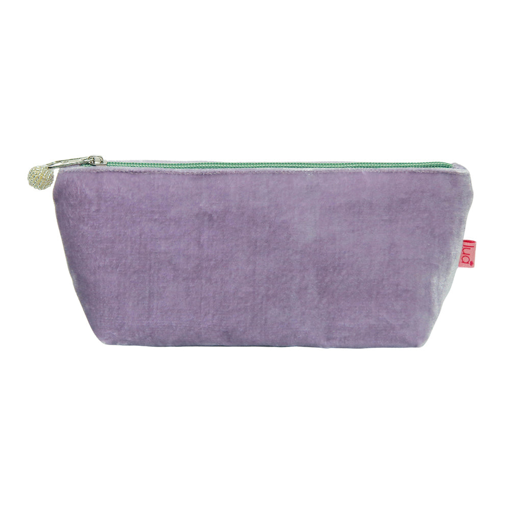 photo of a pale purple or lavender colour velvet pouch with pale sage green zip and beaded zip pull, against a white background