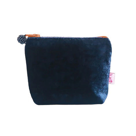 Small dark blue velvet pouch with orange zip and grey beaded zip pull.