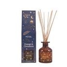 S'Eval Orange & Cinnamon reed diffuser set with a dark blue patterned box and an amber glass bottle containing reeds, on a light beige background.