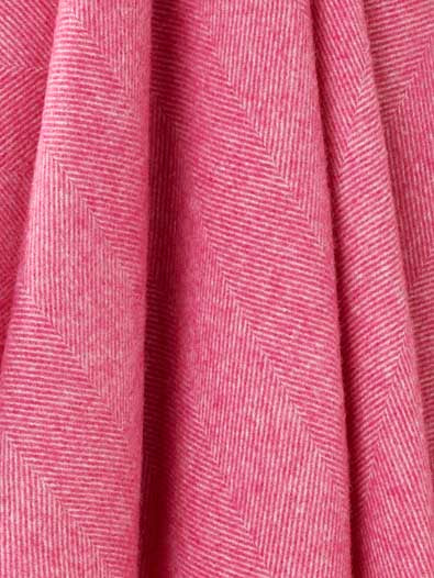 Close-up of pink fabric with a subtle pattern