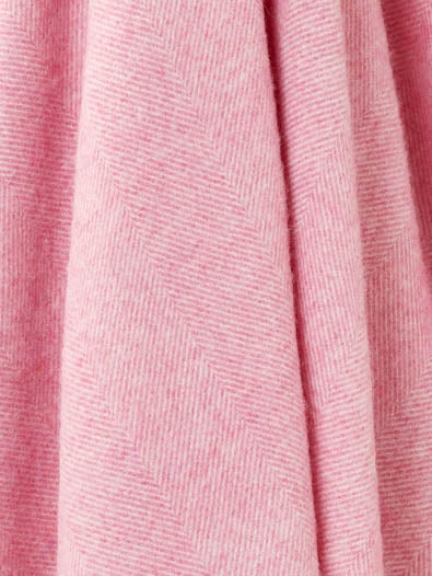 Close-up of pink fabric with a subtle pattern