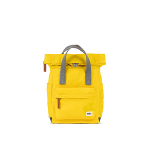 Photo showing the front of a small yellow backpack. There is a large pocket on the front with a brown zip pull, and the handles are grey.