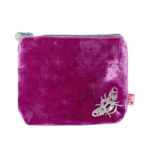 bright pink purse with silver embroidered bee design and a grey zip 