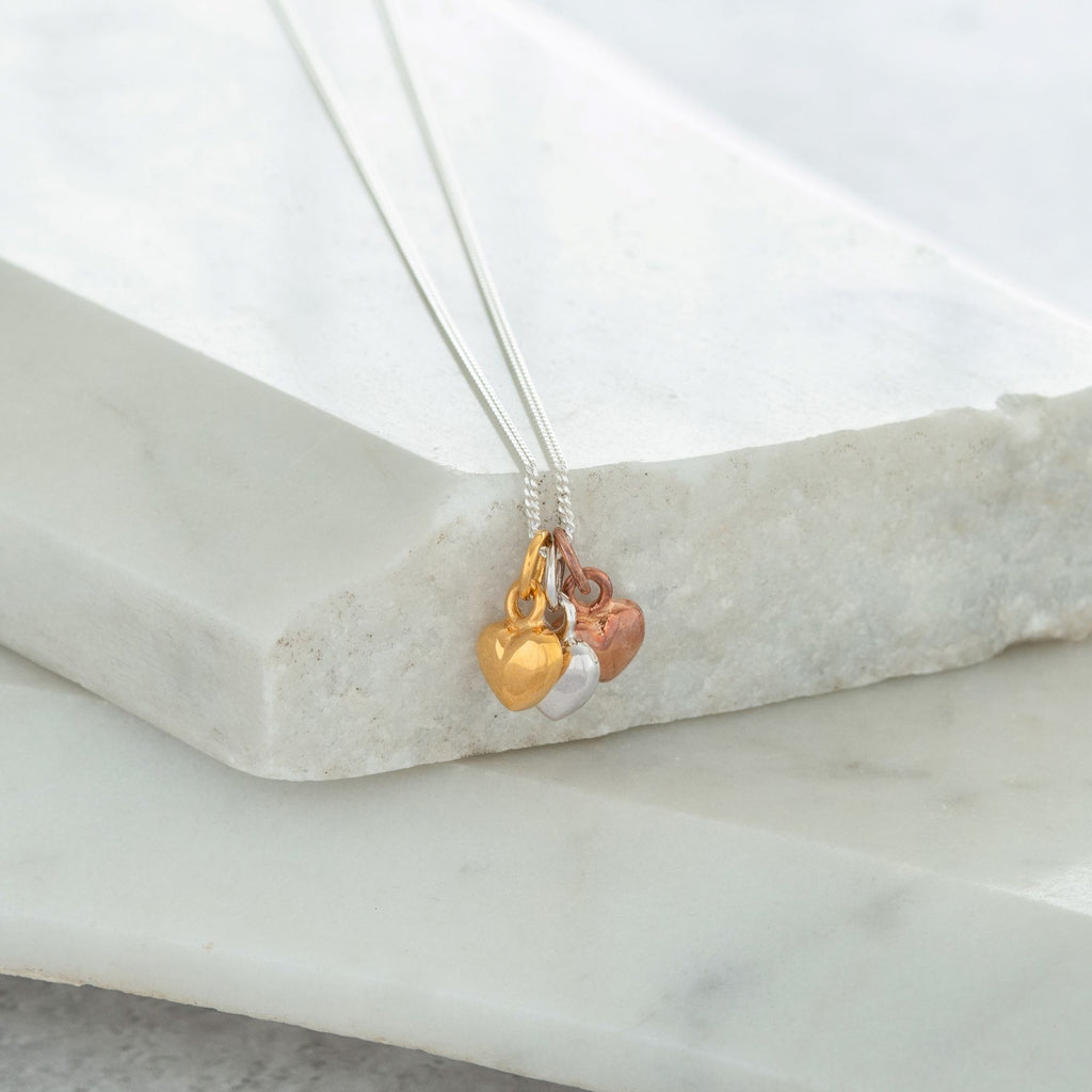 Triple heart store necklace gold