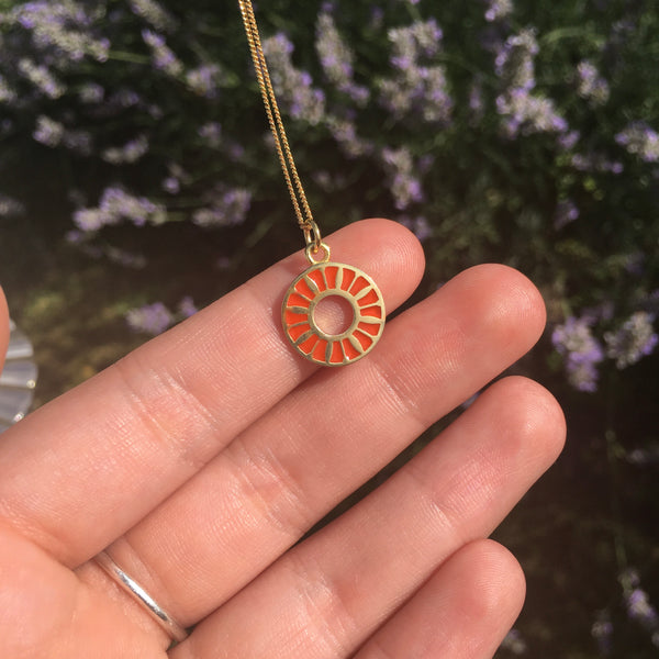 orange flower ring medallion on hand to see size 