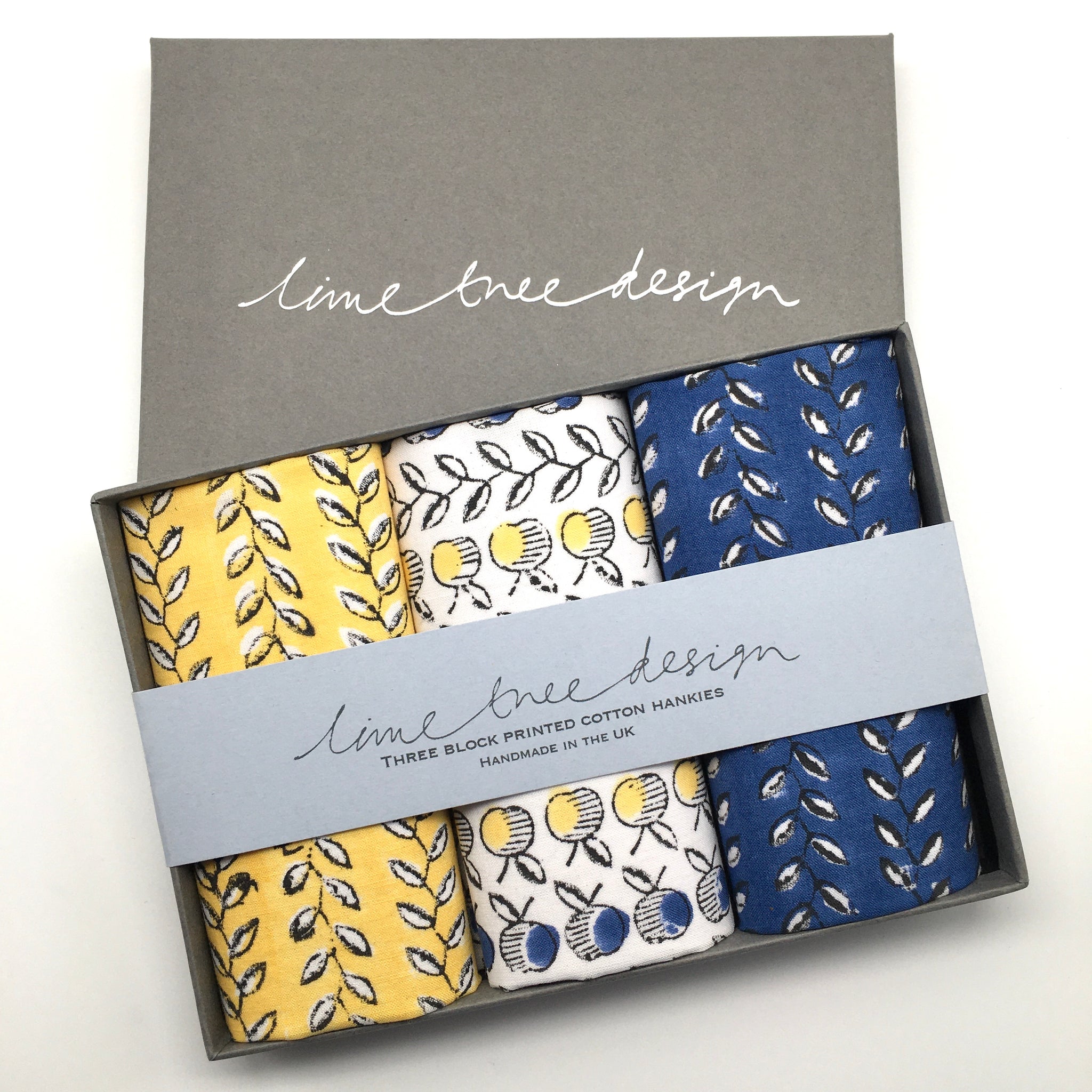 Navy and yellow apple and vine design hankie in a gift box 