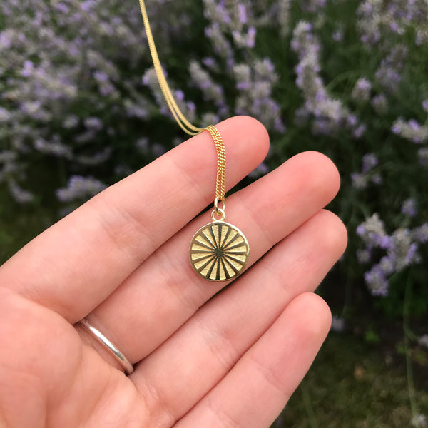 wheel medallion in gold